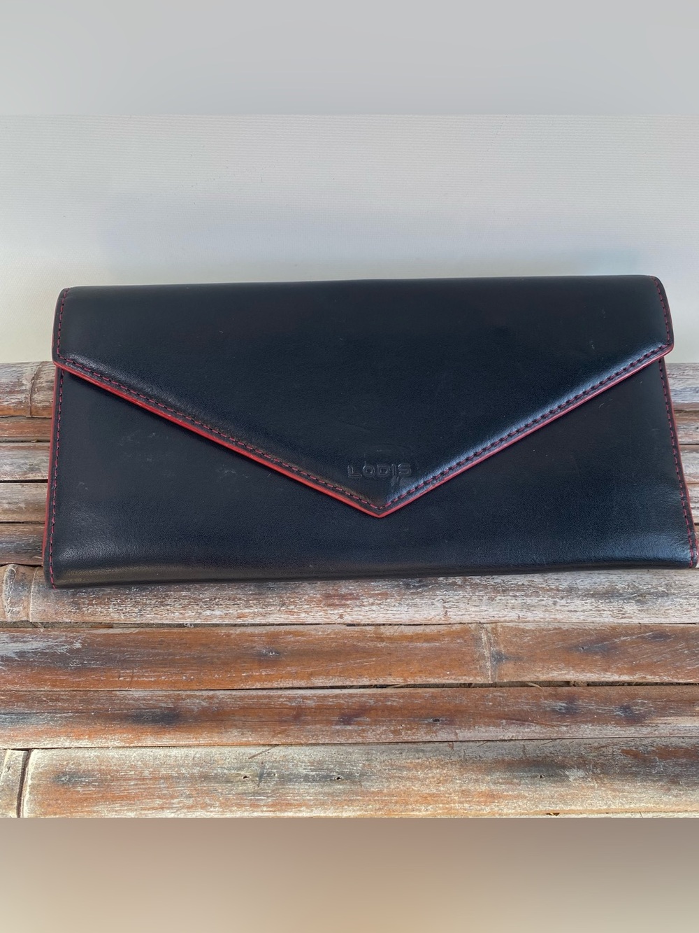 Lodis Audrey Alice tri fold black leather envelope fold wallet red interior